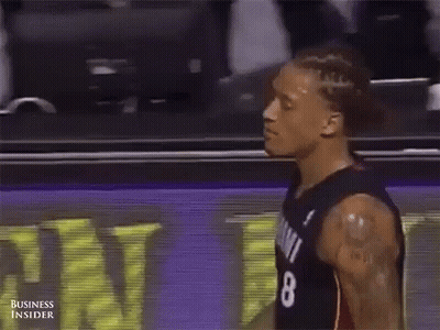 A Basketball Player Wearing A Jersey With The Number 8 On It GIF