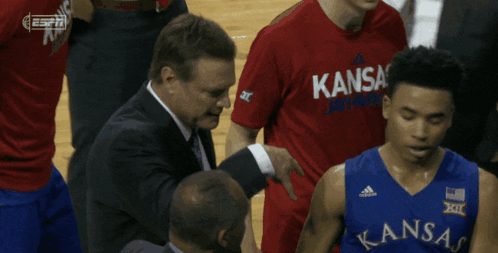 A Basketball Player Wearing A Kansas Jersey Stands On The Court GIF