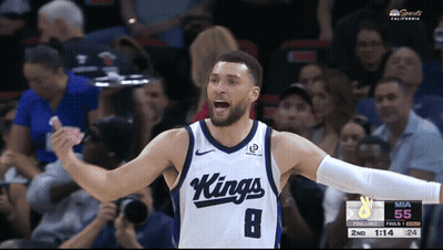 A Basketball Player Wearing A Kings Jersey Celebrates During A Game GIF