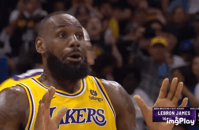 A Basketball Player Wearing A Lakers Jersey Is Making A Funny Face GIF