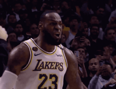 A Basketball Player Wearing A Lakers Jersey With The Number 23 GIF