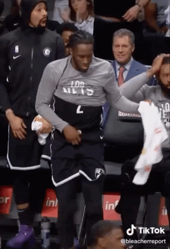 A Basketball Player Wearing A Los Angeles Shirt Is Getting Ready To Play A Game . GIF
