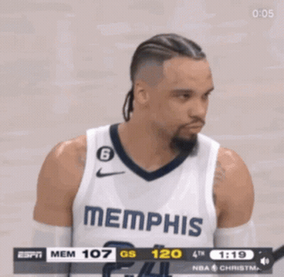 A Basketball Player Wearing A Memphis Jersey Is Looking At The Scoreboard GIF