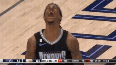 A Basketball Player Wearing A Memphis Jersey Is Screaming GIF