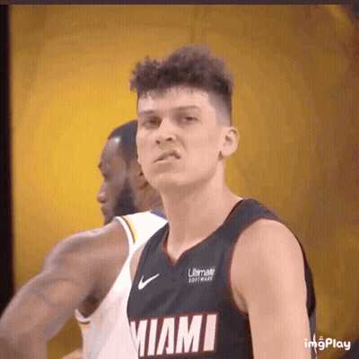 A Basketball Player Wearing A Miami Jersey Looks At The Camera GIF