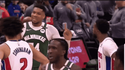 A Basketball Player Wearing A Milwaukee Jersey Is Giving The Middle Finger GIF