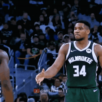 a basketball player wearing a milwaukee jersey number 34