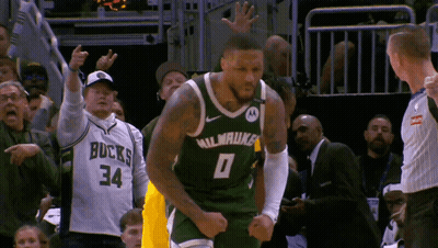 A Basketball Player Wearing A Milwaukee Jersey GIF