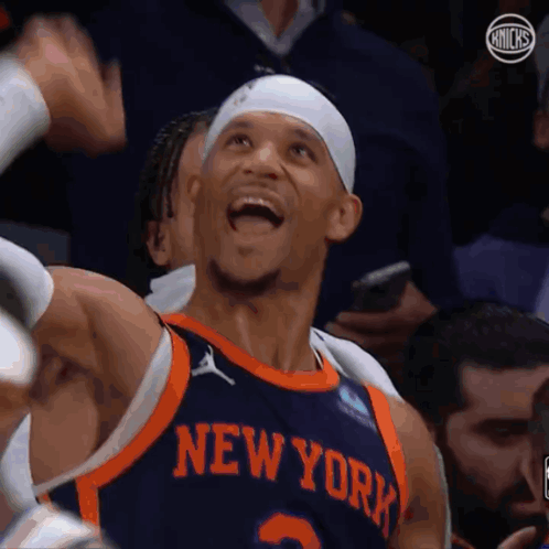 A Basketball Player Wearing A New York Jersey GIF