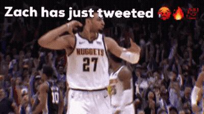 A Basketball Player Wearing A Nuggets Jersey Celebrates In Front Of A Crowd GIF