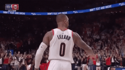 A Basketball Player Wearing A Number 0 Jersey Stands In Front Of A Crowd GIF