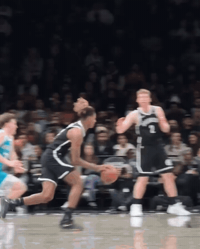 A Basketball Player Wearing A Number 1 Jersey Dribbles The Ball GIF