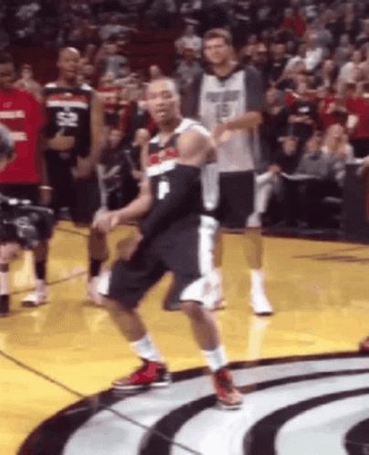 A Basketball Player Wearing A Number 1 Jersey Is Dancing On The Court GIF