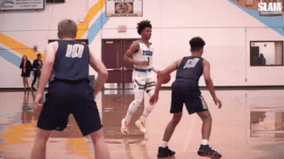 A Basketball Player Wearing A Number 10 Jersey Dribbles The Ball GIF