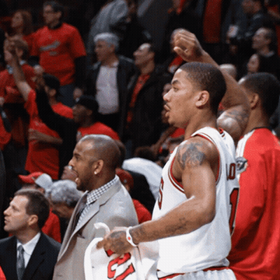 A Basketball Player Wearing A Number 10 Jersey Stands In Front Of A Crowd GIF