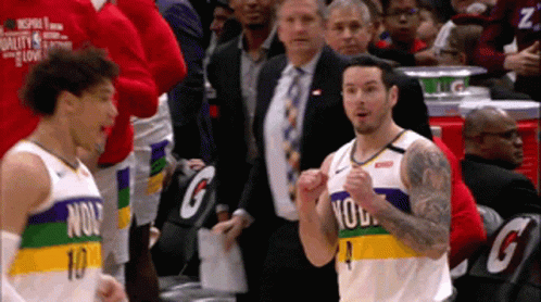 A Basketball Player Wearing A Number 10 Jersey Stands In Front Of A Crowd GIF