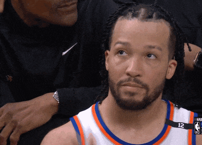 A Basketball Player Wearing A Number 12 Jersey GIF