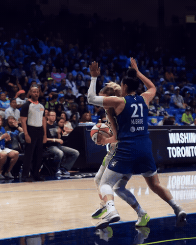 A Basketball Player Wearing A Number 21 Jersey GIF