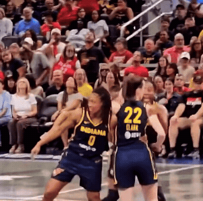 A Basketball Player Wearing A Number 22 Jersey Stands Next To Another Player GIF