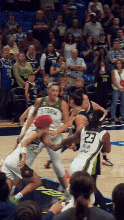 A Basketball Player Wearing A Number 23 Jersey Is Surrounded By Other Players GIF