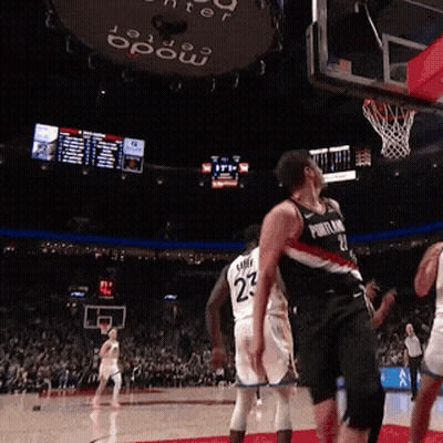 A Basketball Player Wearing A Number 23 Jersey Stands On The Court GIF
