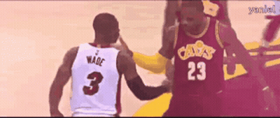 A Basketball Player Wearing A Number 23 Jersey Talks To Another Player Wearing A Number 3 Jersey GIF