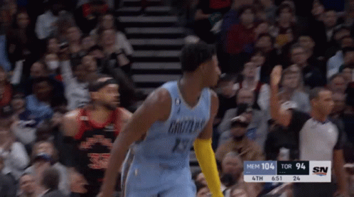 A Basketball Player Wearing A Number 29 Jersey Stands In Front Of A Crowd GIF