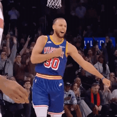 A Basketball Player Wearing A Number 30 Jersey Is Celebrating GIF