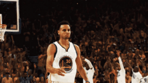 A Basketball Player Wearing A Number 30 Jersey Stands In Front Of A Crowd GIF