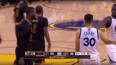 A Basketball Player Wearing A Number 30 Jersey Talks To Another Player GIF