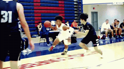 A Basketball Player Wearing A Number 31 Jersey Dribbles The Ball GIF