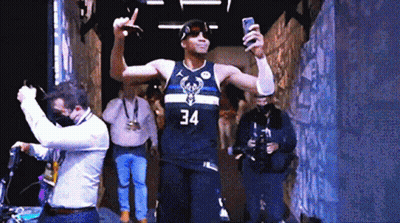 A Basketball Player Wearing A Number 34 Jersey Takes A Selfie GIF