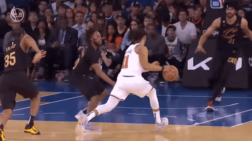 A Basketball Player Wearing A Number 35 Jersey Dribbles The Ball GIF