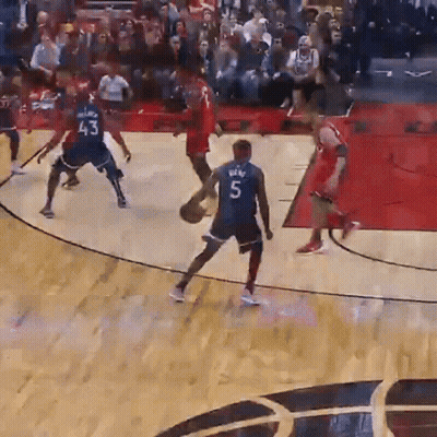 A Basketball Player Wearing A Number 5 Jersey Dribbles The Ball GIF
