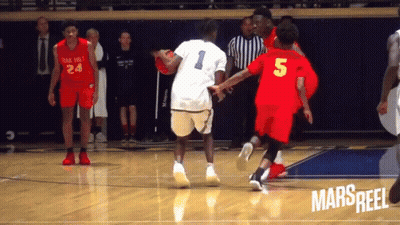 A Basketball Player Wearing A Number 5 Jersey Dribbles The Ball GIF