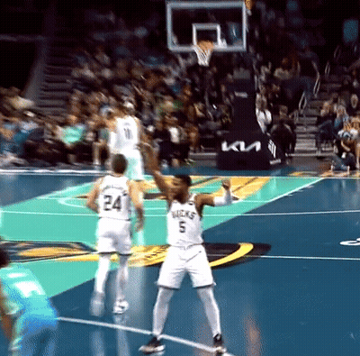 A Basketball Player Wearing A Number 5 Jersey Stands On The Court GIF