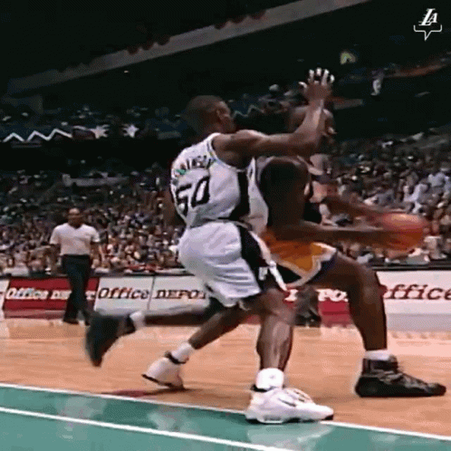 A Basketball Player Wearing A Number 50 Jersey Is Dribbling The Ball GIF
