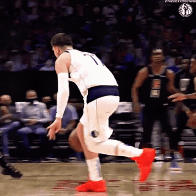 A Basketball Player Wearing A Number 7 Jersey Is Jumping In The Air GIF