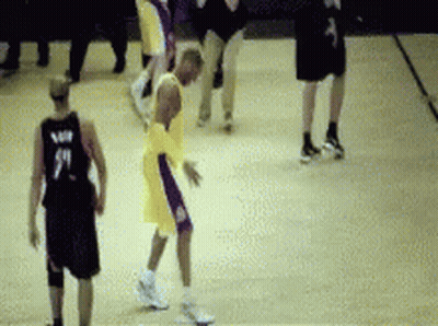 A Basketball Player Wearing A Number 9 Jersey Is Dribbling The Ball GIF