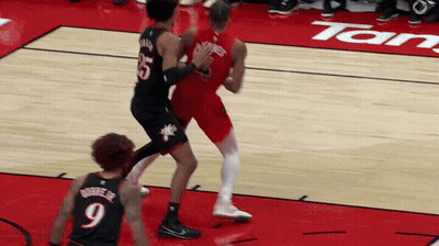 A Basketball Player Wearing A Number 9 Jersey Stands On The Court GIF