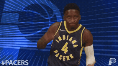 A Basketball Player Wearing A Pacers Jersey Is Clapping GIF