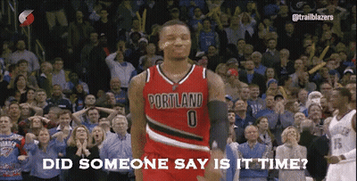 A Basketball Player Wearing A Portland Jersey Is Standing In Front Of A Crowd GIF