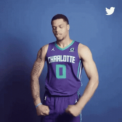A Basketball Player Wearing A Purple Jersey With Charlotte On It GIF