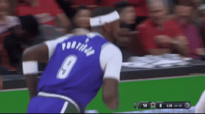 A Basketball Player Wearing A Purple Jersey With The Number 9 On The Back GIF
