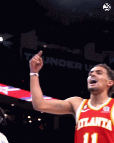 A Basketball Player Wearing A Red Atlanta Jersey With The Number 11 On It GIF