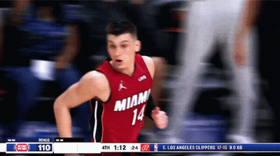A Basketball Player Wearing A Red Jersey That Says Miami 14 GIF