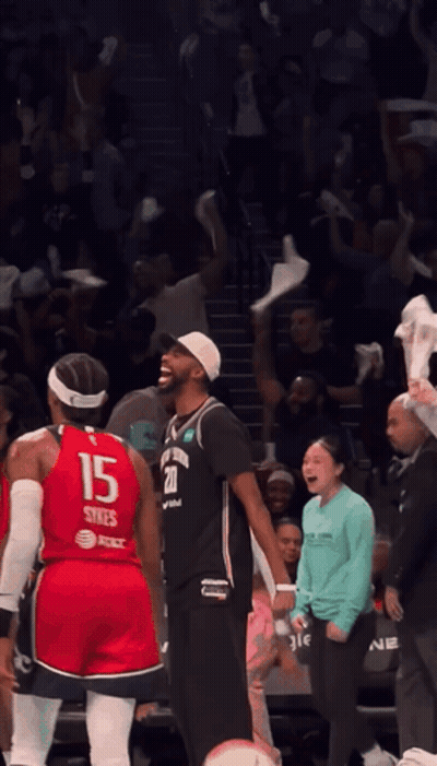 A Basketball Player Wearing A Red Jersey With The Number 15 On It GIF