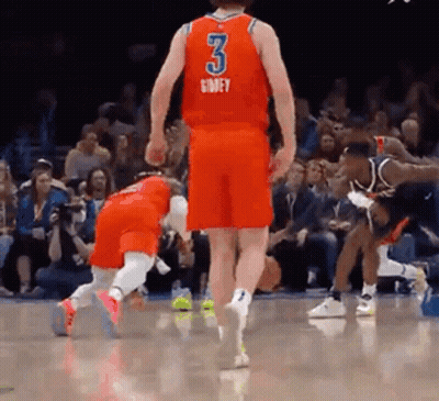 A Basketball Player Wearing A Red Jersey With The Number 3 On It Is Standing On A Court . GIF