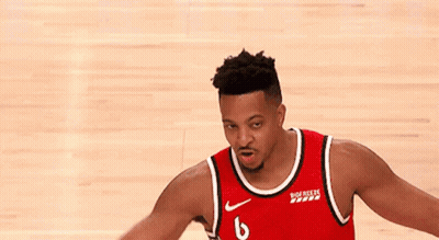 A Basketball Player Wearing A Red Jersey With The Number 6 On It Is Standing On A Basketball Court . GIF
