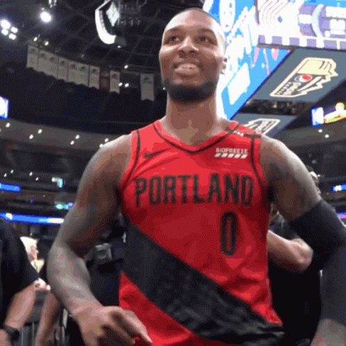 A Basketball Player Wearing A Red Portland Jersey With The Number 0 On It GIF